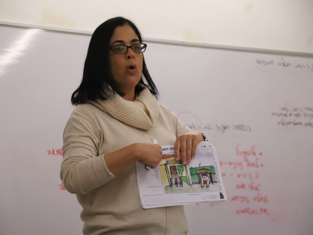 Teacher guiding student through a cognitive challenge using mediated learning