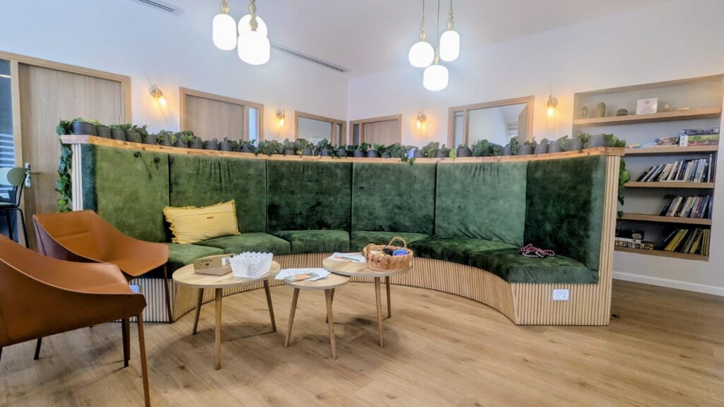 Interior of the waiting area at the Feuerstein Institute’s post-trauma rehabilitation department, showing seating, natural lighting, and a welcoming environment.